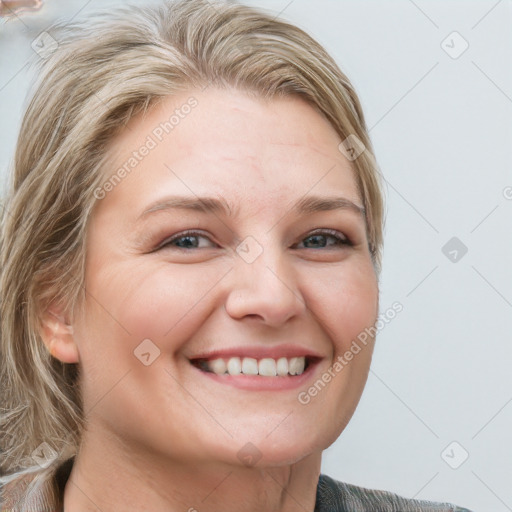 Joyful white young-adult female with short  brown hair and blue eyes