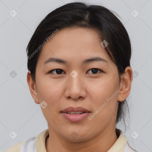 Joyful asian young-adult female with short  brown hair and brown eyes