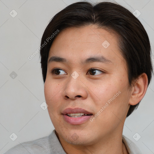 Joyful asian young-adult male with short  brown hair and brown eyes