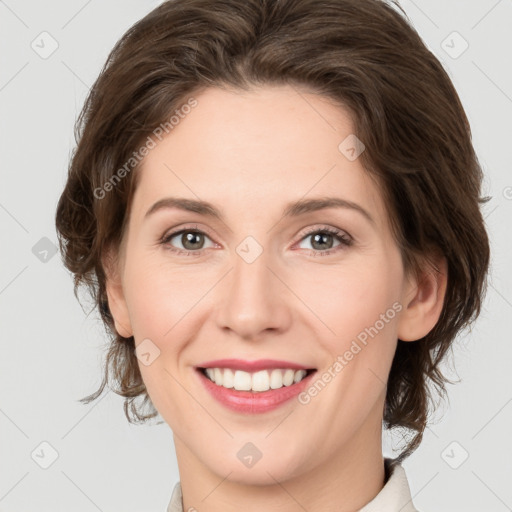 Joyful white young-adult female with medium  brown hair and green eyes