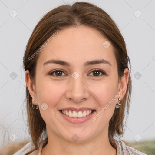 Joyful white young-adult female with medium  brown hair and grey eyes