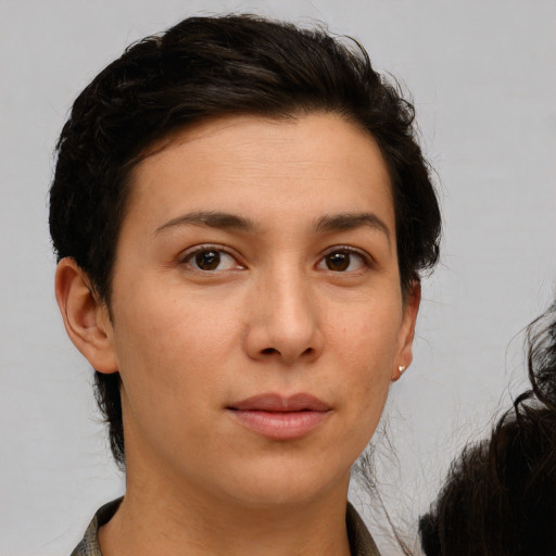 Neutral white young-adult female with medium  brown hair and brown eyes