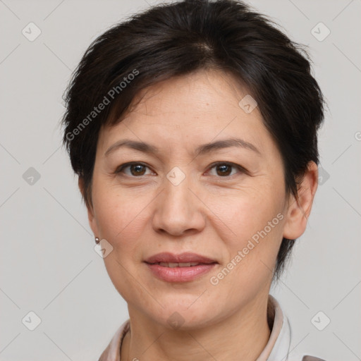 Joyful white adult female with medium  brown hair and brown eyes