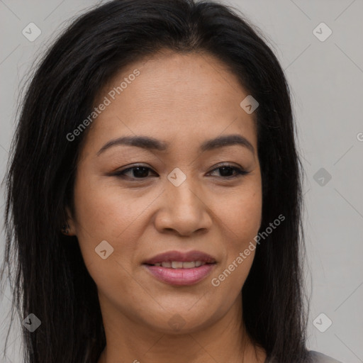 Joyful asian young-adult female with long  brown hair and brown eyes