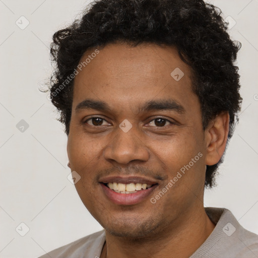Joyful latino young-adult male with short  brown hair and brown eyes