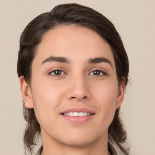 Joyful white young-adult female with medium  brown hair and brown eyes