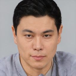 Neutral asian young-adult male with short  brown hair and brown eyes