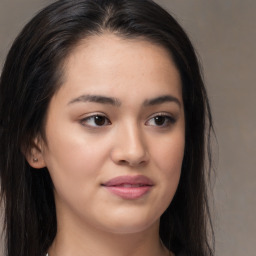 Joyful asian young-adult female with long  brown hair and brown eyes