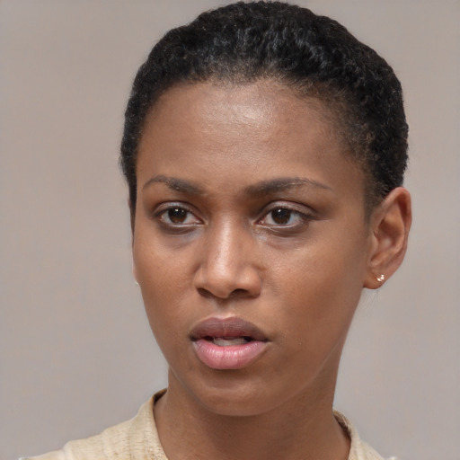 Neutral latino young-adult female with short  brown hair and brown eyes