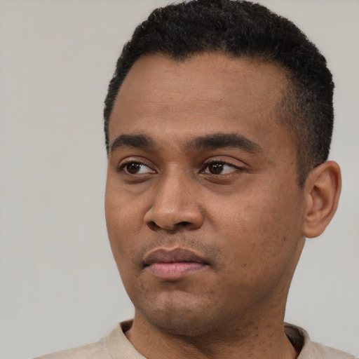 Neutral black young-adult male with short  black hair and brown eyes