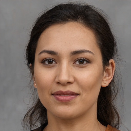 Joyful white young-adult female with long  brown hair and brown eyes