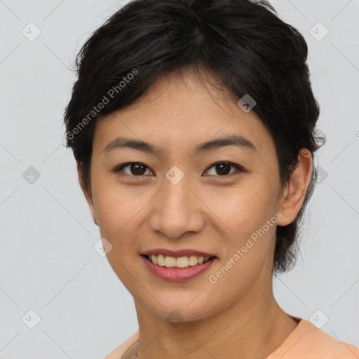 Joyful asian young-adult female with short  brown hair and brown eyes