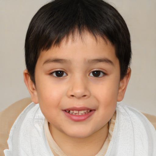 Joyful white child male with short  brown hair and brown eyes