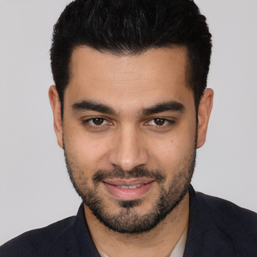 Joyful white young-adult male with short  black hair and brown eyes