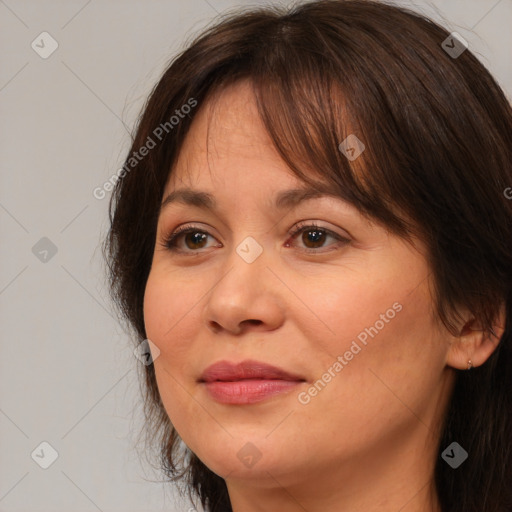 Joyful white adult female with medium  brown hair and brown eyes