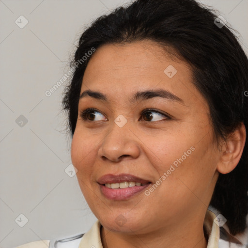 Joyful asian young-adult female with medium  brown hair and brown eyes