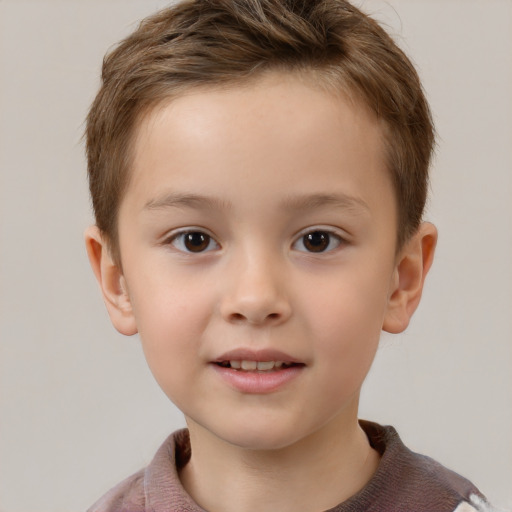 Joyful white child male with short  brown hair and brown eyes