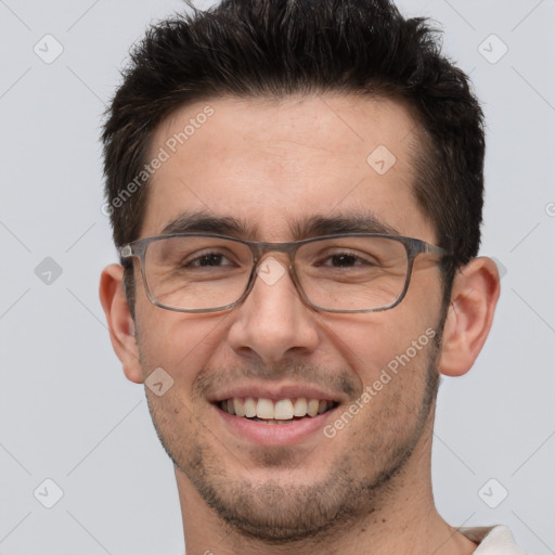 Joyful white adult male with short  brown hair and brown eyes