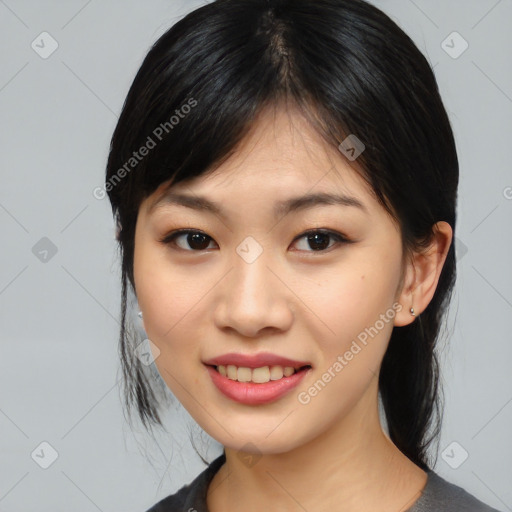 Joyful asian young-adult female with medium  black hair and brown eyes