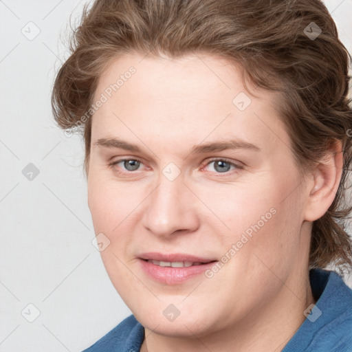 Joyful white young-adult female with medium  brown hair and blue eyes