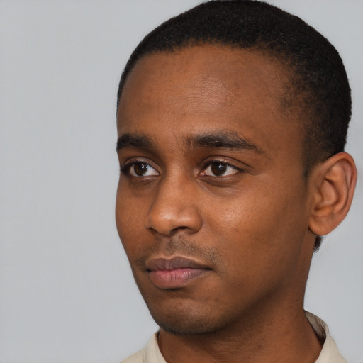 Neutral black young-adult male with short  black hair and brown eyes