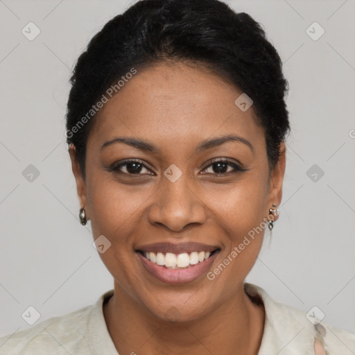 Joyful black young-adult female with short  black hair and brown eyes