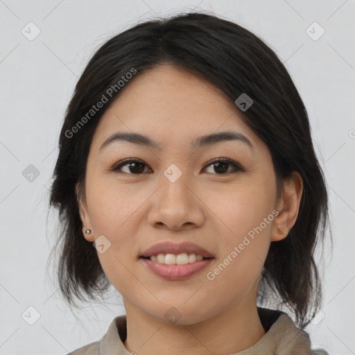 Joyful asian young-adult female with medium  black hair and brown eyes