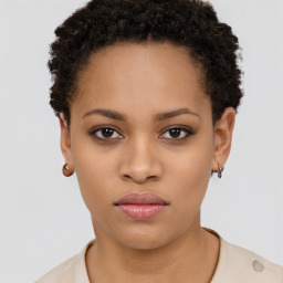 Joyful black young-adult female with short  brown hair and brown eyes