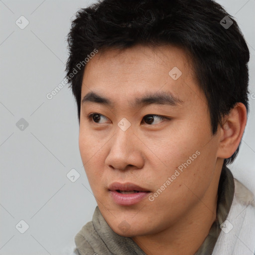 Neutral asian young-adult male with short  black hair and brown eyes