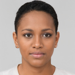 Joyful black young-adult female with short  brown hair and brown eyes