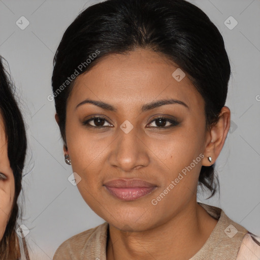 Joyful latino young-adult female with medium  brown hair and brown eyes