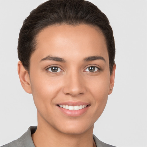 Joyful white young-adult female with short  brown hair and brown eyes