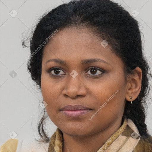 Joyful black young-adult female with long  brown hair and brown eyes