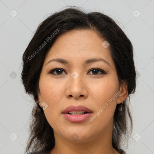 Joyful asian young-adult female with long  brown hair and brown eyes