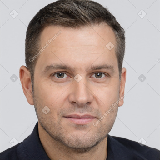 Joyful white adult male with short  brown hair and brown eyes