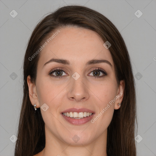 Joyful white young-adult female with long  brown hair and grey eyes