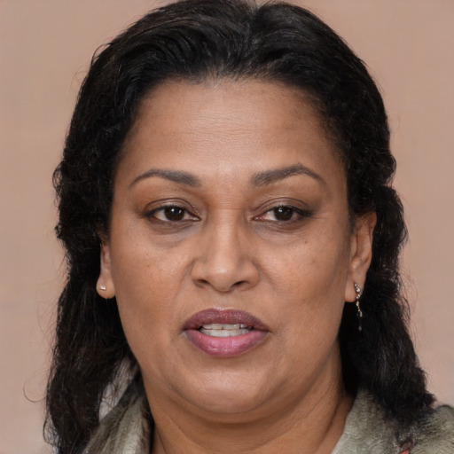 Joyful black adult female with medium  brown hair and brown eyes