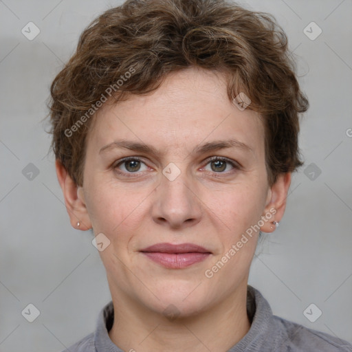 Joyful white adult female with short  brown hair and grey eyes