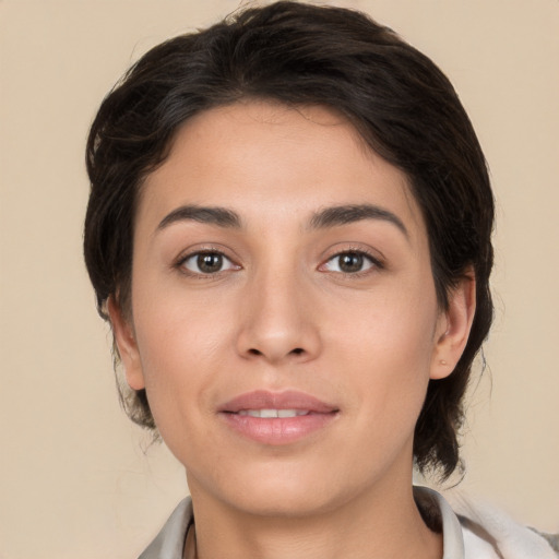 Joyful white young-adult female with medium  brown hair and brown eyes