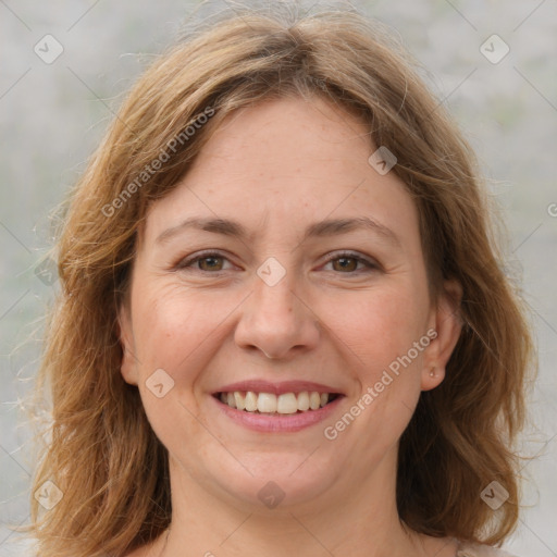 Joyful white young-adult female with medium  brown hair and green eyes