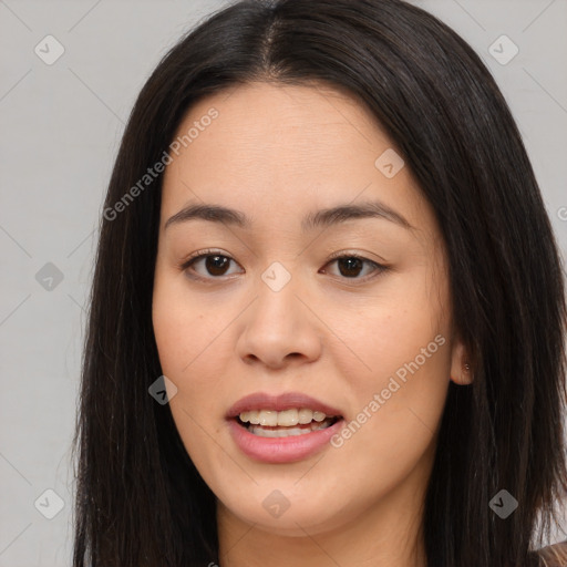 Joyful asian young-adult female with long  brown hair and brown eyes