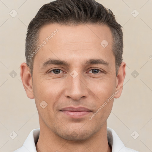 Joyful white adult male with short  brown hair and brown eyes