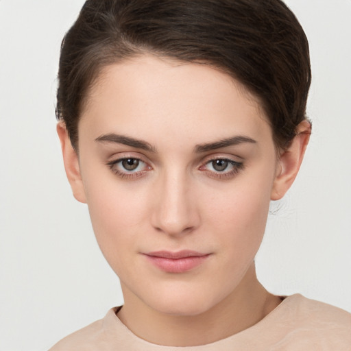 Neutral white young-adult female with short  brown hair and brown eyes