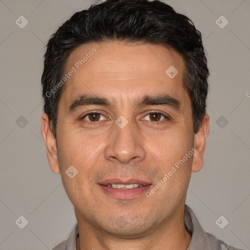 Joyful white adult male with short  black hair and brown eyes