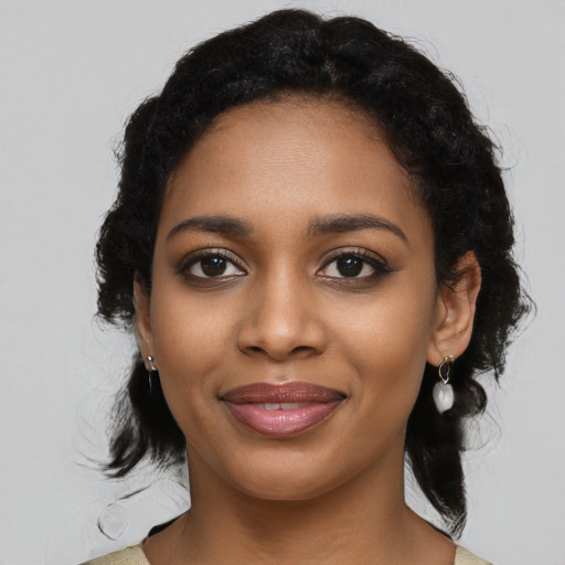 Joyful black young-adult female with medium  black hair and brown eyes