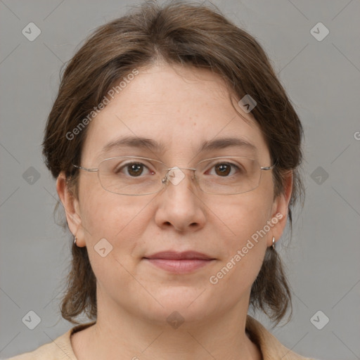 Joyful white adult female with medium  brown hair and brown eyes