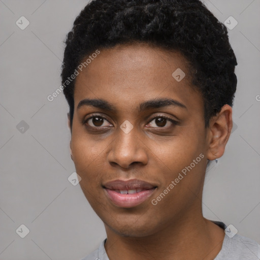 Joyful black young-adult female with short  black hair and brown eyes