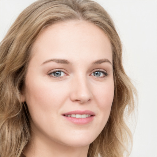 Joyful white young-adult female with long  brown hair and blue eyes