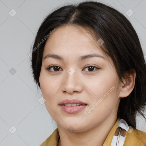 Joyful asian young-adult female with medium  brown hair and brown eyes