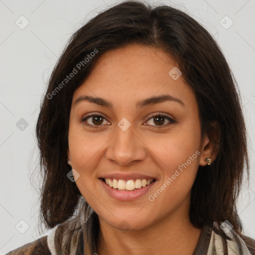 Joyful latino young-adult female with long  brown hair and brown eyes